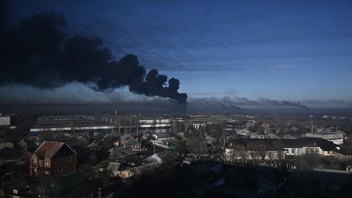 Black smoke rises from a military airport in Chuguyev near Kharkiv  on February 24, 2022. - Russian President Vladimir Putin announced a military operation in Ukraine today with explosions heard soon after across the country and its foreign minister warning a "full-scale invasion" was underway. (Photo by Aris Messinis / AFP)